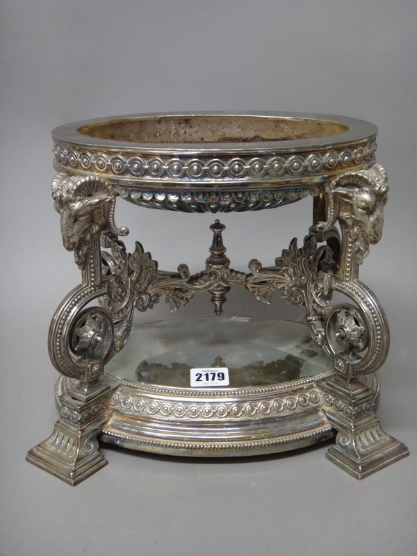 A Victorian silver plated table centrepiece stand, of oval form, the four supports with goat's head mask finials, above beaded curved supports, raised