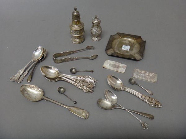 Silver, comprising; a set of twelve teaspoons, the handles with pierced and cast decoration, Birmingham 1910, a pair of sugar tongs in a matching desi