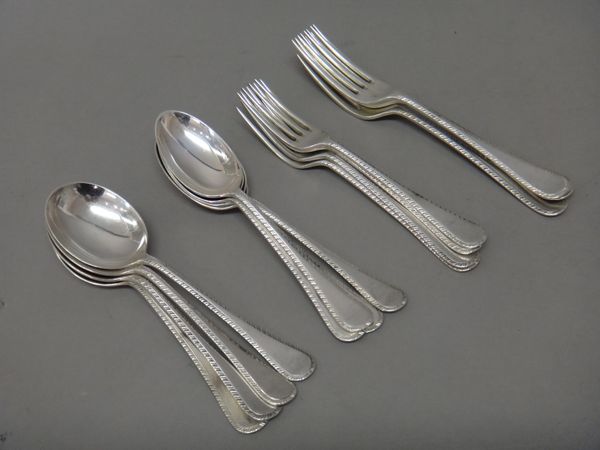 Silver feather edged Old English pattern table flatware, comprising; four table forks, four dessert forks, four soup spoons and four dessert spoons, S