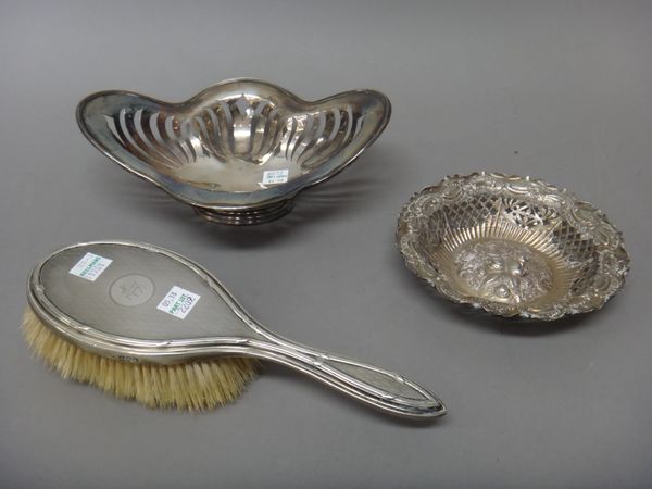 Silver and silver mounted wares, comprising; a lady's hairbrush with engine turned decoration, London 1914, a quatrefoil shaped dish with pierced deco