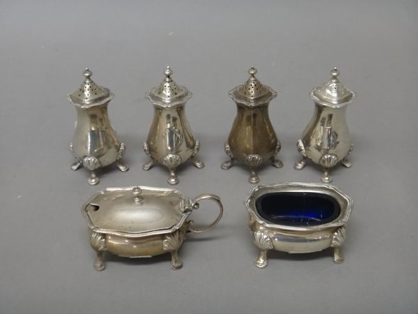 Silver and silver mounted wares, comprising; four pepperettes, London 1914, a mustard pot, London 1915 and a salt, London 1915, combined weight 235gms