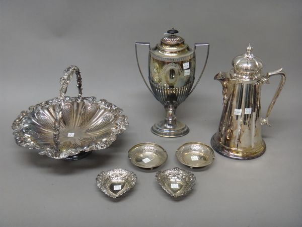 A pair of silver bon bon dishes, each of circular form with pierced decoration and with a swing over handle, Birmingham 1914, a pair of silver heart s