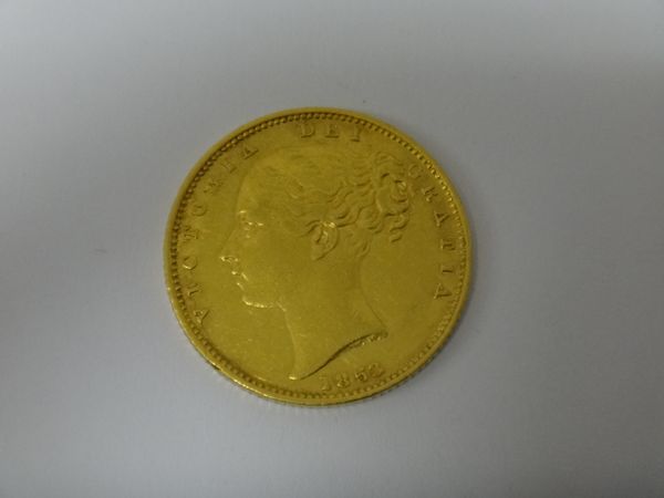 A Victoria young head shield back sovereign 1853.