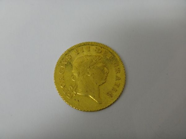 A George III half guinea, 7th head 1810.   Illustrated