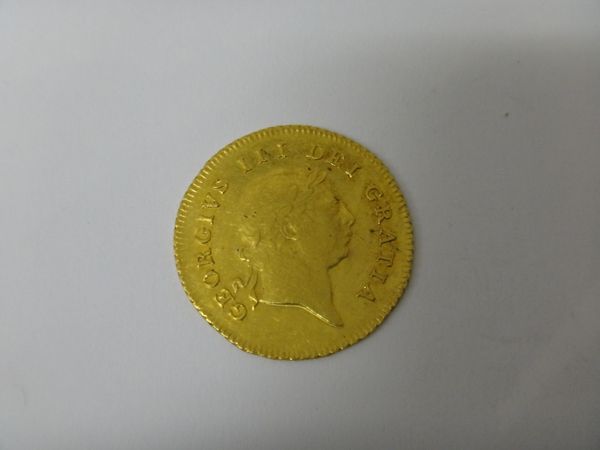 A George III half guinea, 7th head 1810.