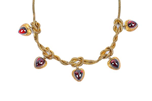 A Victorian gold and carbuncle garnet necklace, circa 1860, in an entwined Brazil link design with five carbuncle garnet set heart shaped pendant lock