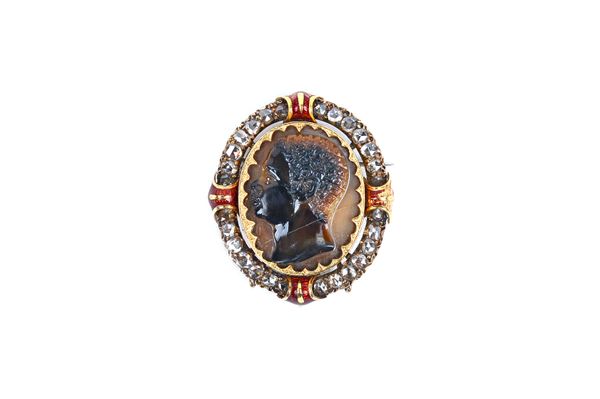 A rose diamond, carved agate and red enamelled oval brooch, the agate cameo carved as the head of a blackamoor, (cracked) within a surround of rose cu