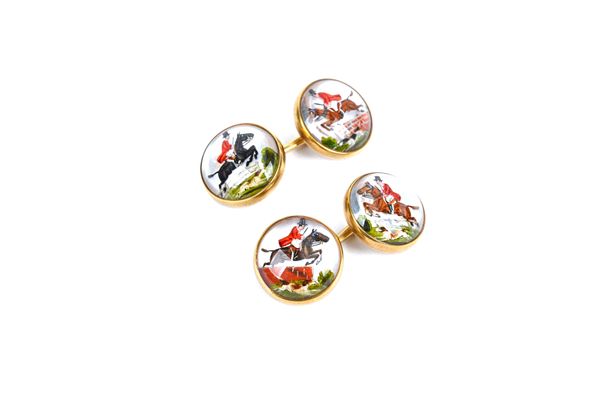 A pair of gold mounted reverse painted intaglio crystal cufflinks, each intaglio painted with a differing view of a horseman jumping a fence, the conn