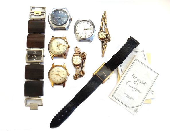 A Must De Cartier silver gilt, rectangular cased Tank Quartz wristwatch, with three booklets, a Lanco lady's 9ct gold cased wristwatch, a Mondaine lad