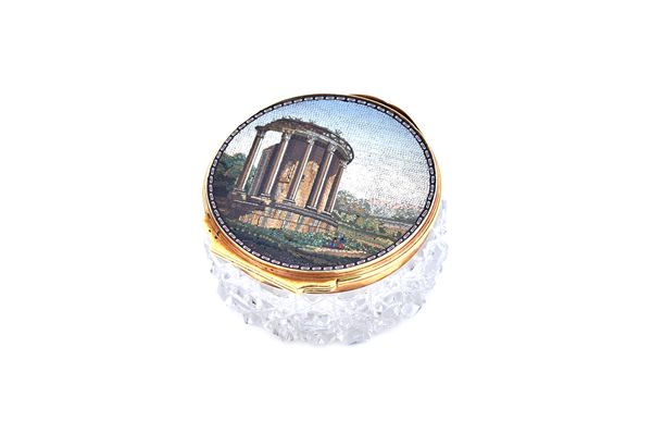 A gold and mosaic mounted hinge lidded hobnail cut faceted glass circular box, the mosaic designed as the ruin of a classic temple with pillars in a l