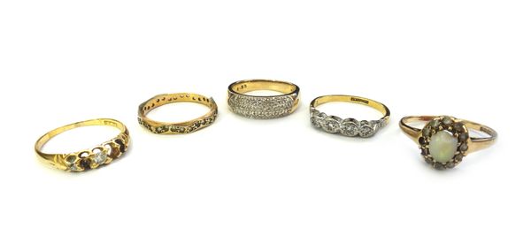 A gold and platinum ring, mounted with a row of four circular cut diamonds, detailed 18 CT PLAT, a 9ct gold ring mounted with three rows of circular c