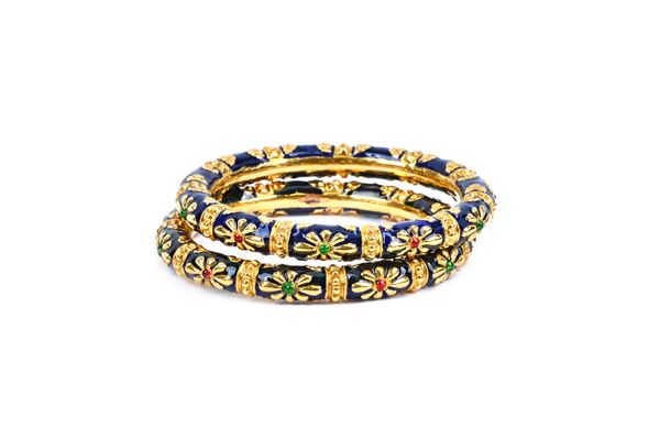 A pair of Indian gold bangles, with dark blue, black, green and red enamelled decoration, having stylised flowerhead motifs, gross combined weight 53