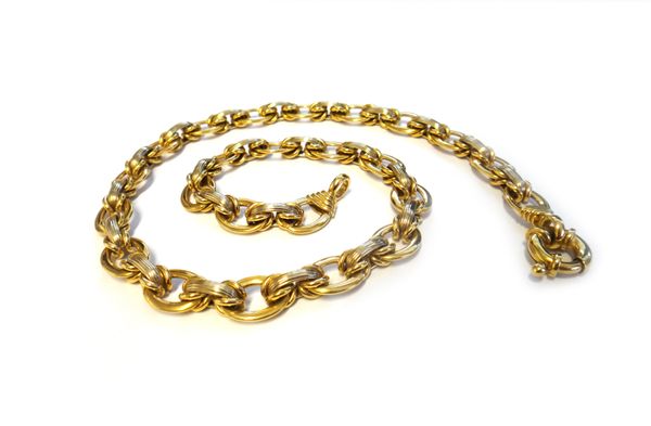 A two colour gold chain link necklace, stamped 800, in a reeded oval and larger plain oval link design, with a boltring clasp, length 47cm, weight 36.