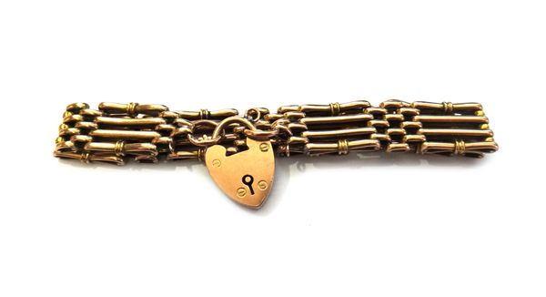 A gold decorated bar and oval link gate bracelet, on a gold heart shaped padlock clasp, detailed 9 CT, weight 15.4 gms.