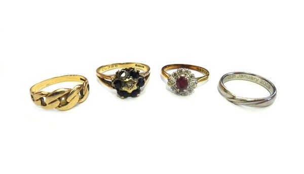 An 18ct gold, ruby and diamond cluster ring, claw set with the oval cut ruby at the centre, a 9ct gold, sapphire and diamond cluster ring, (one sapphi