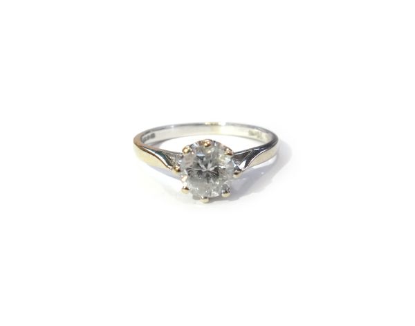 An 18ct carat white gold and diamond single stone ring, claw set with a circular cut diamond, the shank detailed 75 PTS, ring size N and a half.