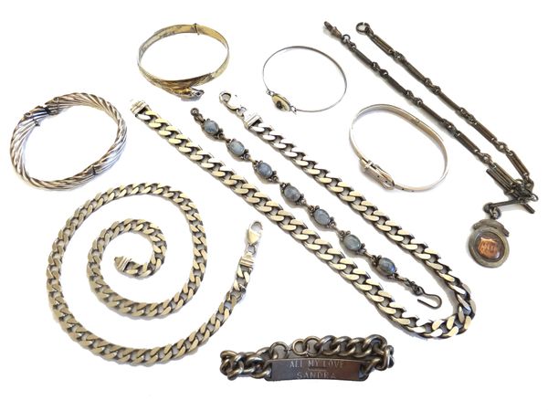 Mostly silver jewellery, comprising; two faceted curb link neckchains, a watch Albert chain, with a silver fob medallion, four bangles, two bracelets,