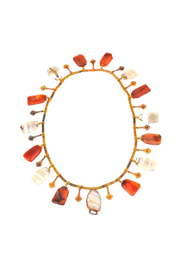 A Victorian gold and vary coloured agate necklace, circa 1860, formed as a row of vary coloured agate drops, alternating with smaller gold drops, cent