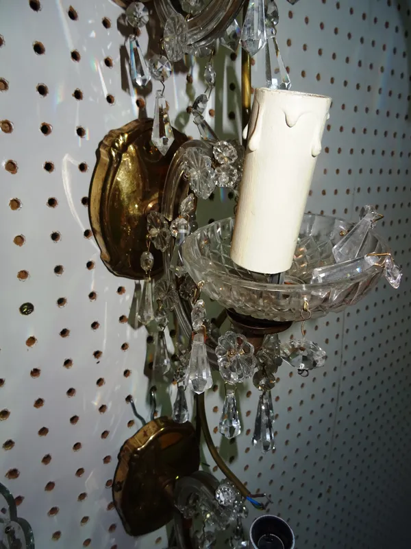 Lighting comprising; a group of seven similar 20th century glass and brass single branch wall lights, (7).  H10