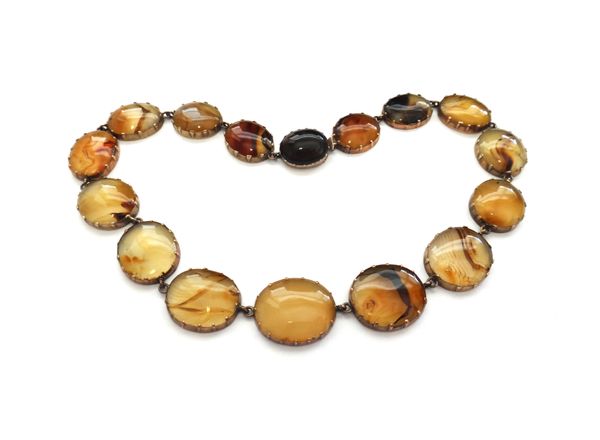 A gold mounted vary coloured agate necklace, formed as a series of graduated oval links, on a snap clasp, mid-19th century, with a fitted case.