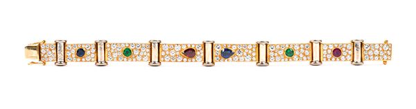 A gold, diamond, ruby, emerald and sapphire bracelet, the links formed as a row of rectangular panels, mounted with a pear shaped ruby, a pear shaped