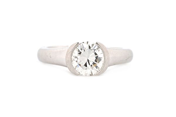 A platinum and diamond set single stone ring, by Boodles, mounted with a circular cut diamond, ring size E and a half (note arthritic bobbles), gross