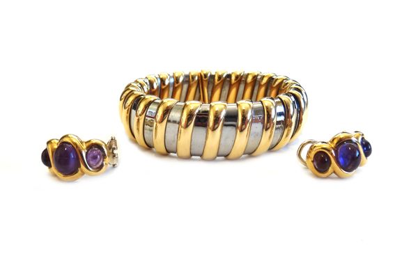 A pair of gold and cabochon amethyst earclips, each in a curved design, mounted with three oval cabochon amethysts, the replacement backs with folding