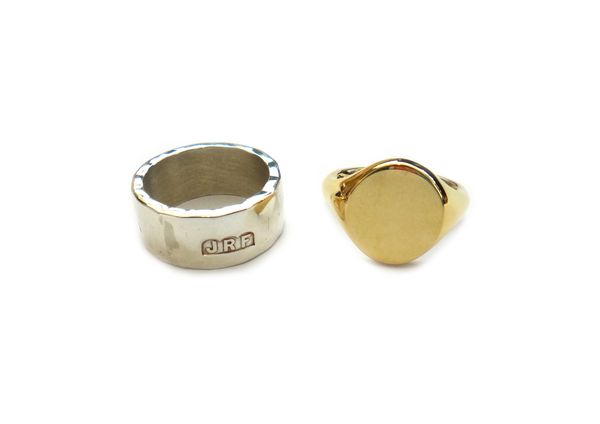 A gentleman's 18ct gold oval plain signet ring, ring size S and a half, weight 19.7 gms and a silver wide band ring, having martele decoration, ring s