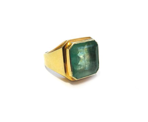 A gold and emerald single stone signet style ring, mounted with a cut cornered rectangular emerald, in an undecorated setting, apparently unmarked, ri