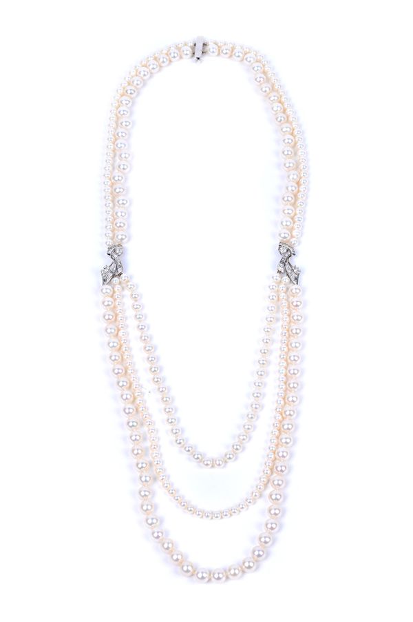 A two and three row necklace of vary sized cultured pearls, with two diamond set integral motifs at intervals, each mounted with a marquise shaped dia