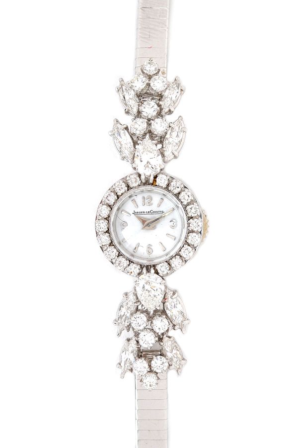 A Jaeger-Le Coultre white gold and diamond set rear winding lady's bracelet wristwatch, the signed circular white dial with Arabic and arrow shaped nu