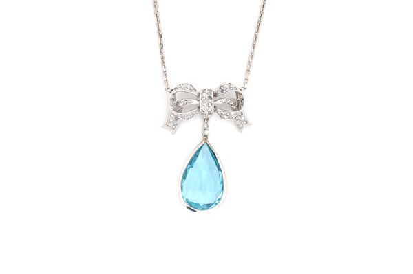 An aquamarine and diamond pendant necklace, the front with a spectacle set pear shaped aquamarine drop, below a diamond set tied bow surmount, mounted