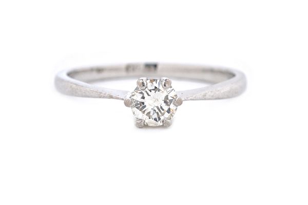 A solitaire diamond ring, the round brilliant cut diamond weighing approx 0.33 cts, claw set in white metal, indistinctly stamped PLAT, ring size M an