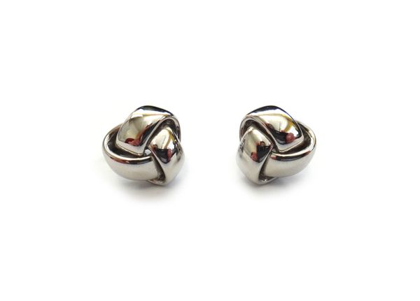 A pair of 18ct white gold earclips, each in an entwined trefoil shaped design, the backs with post and folding clip fittings, weight 6.7 gms, with a M