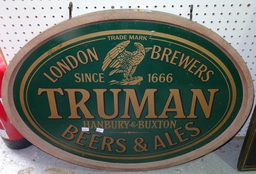 A group of three 20th century wooden beer/ale advertising signs, to include; 'Truman Beers & Ales' 86cm wide x 65cm high, 'Windmill Fine Ale' 61cm wid