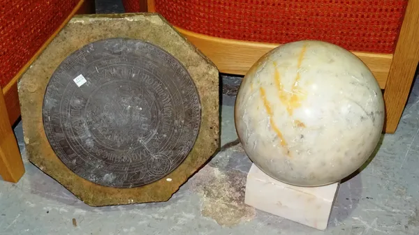 A similar pair of 20th century alabaster spherical balls on stand and a carved stone sundial top with plate, (a.f), (3).   I8