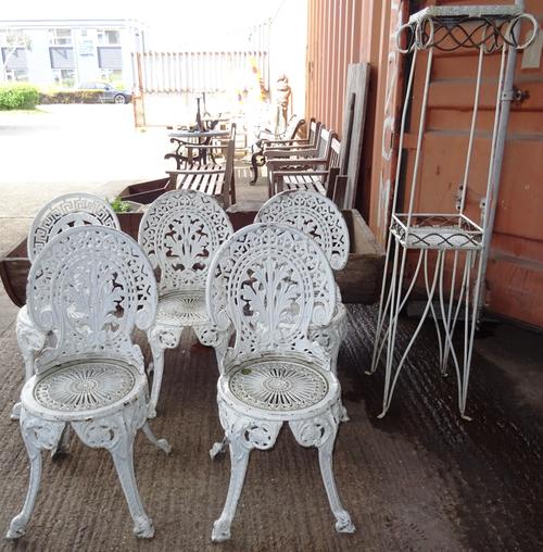 Garden furniture, including; five 20th century cast iron chairs of various designs and a 20th century white painted metal two tier jardiniere stand, 3