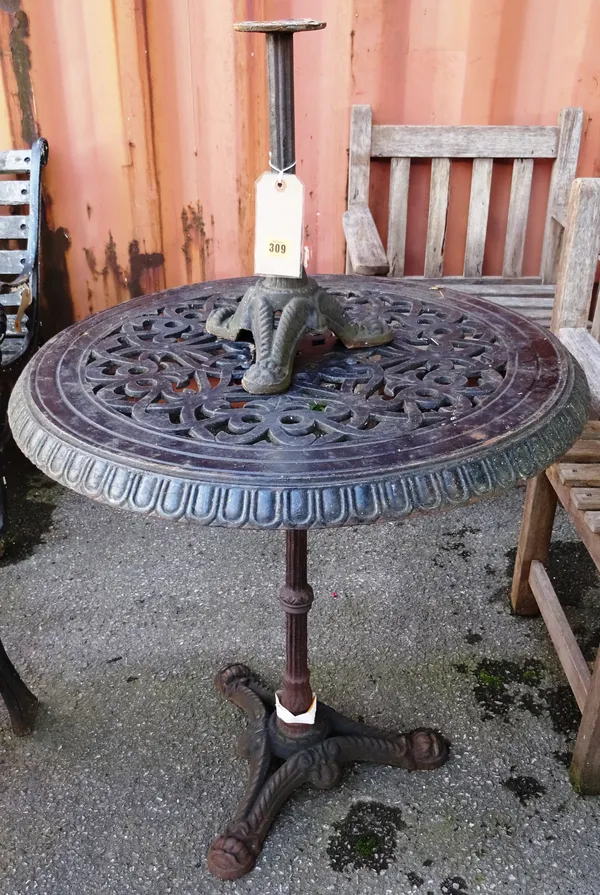 Garden statuary, including; an early 20th century cast iron circular garden table, a similar table with white marble top 72cm wide x 71cm high and a p