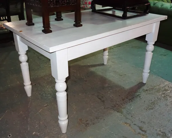 A 20th century white painted rectangular pine dining table, 137cm wide.  F7