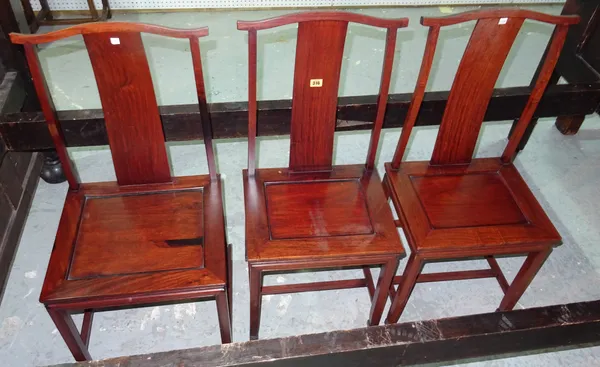 A pair of 20th century Chinese hardwood yoke back dining chairs, with solid seats and square supports, 44cm wide x 92cm high, and another similar, (3)