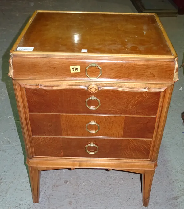 A mid-20th century ash and walnut four drawer bedside table with tapering square supports, 57cm wide.  G5