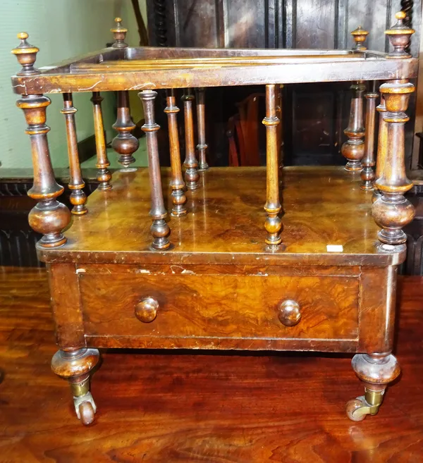 A Victorian walnut three division Canterbury with single drawer base and turned supports, 47cm wide.   D7