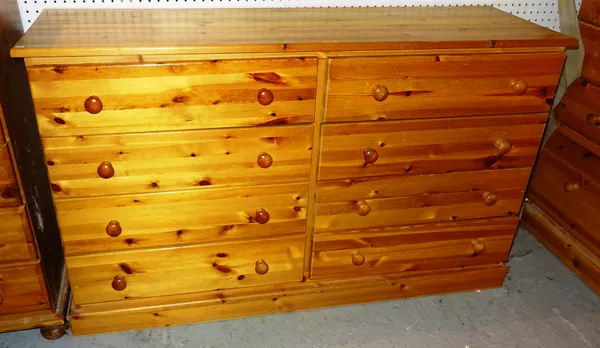 A 20th century pine sideboard with eight short drawers, 136cm wide x 81cm high and a 20th century pine tall chest of five drawers, 70cm wide x 98cm hi
