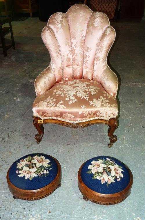 A Victorian mahogany framed shell back low armchair, together with a pair of early 20th century mahogany and satinwood banded circular footstools, 29c
