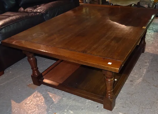 A 20th century oak rectangular two tier coffee table, on block supports, 122cm wide x 47cm high.  M1