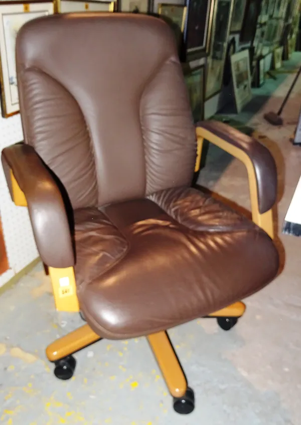 A 20th century hardwood office swivel open armchair, with faux green leather upholstery.  M1