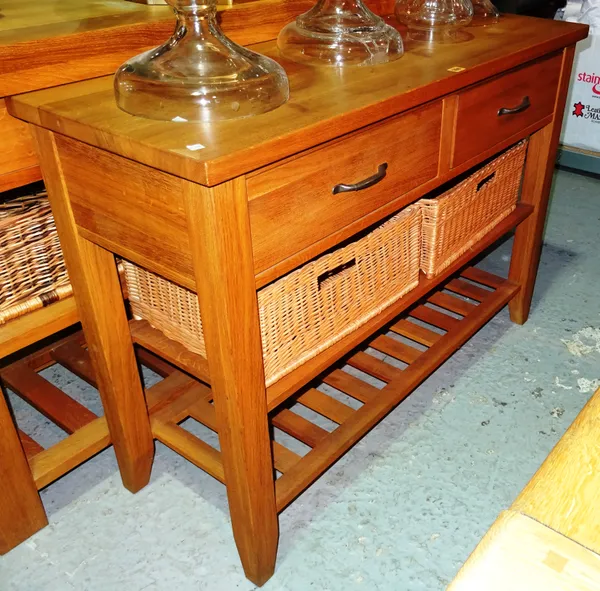 A 20th century oak sideboard, with two drawers and two tier shelf, with two wicker baskets, 120cm wide x 80cm high x 45cm deep.  H2