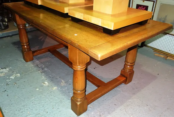 A 20th century oak refectory table, on block supports united by stretcher, 182cm wide x 78cm high.  H1