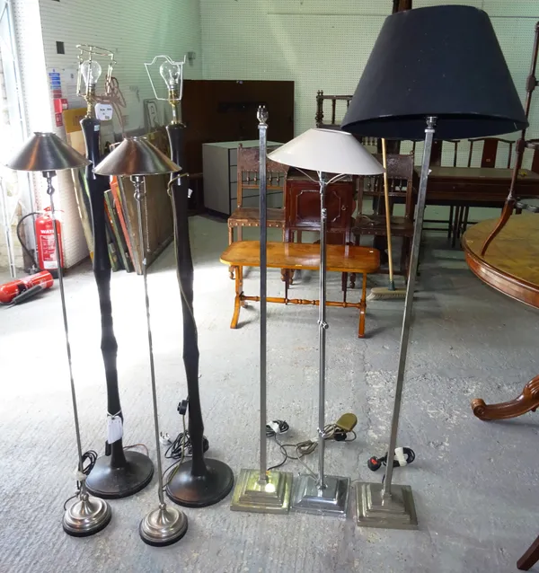 A group of seven 20th century metal standard lamps, of various sizes, to include three pairs and a single lamp, (7).  C9