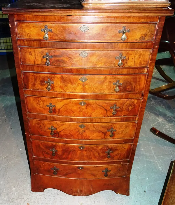 A George III style walnut bowfront chest of seven drawers, on bracket feet, 70cm wide x 115cm high. 8.1  C10